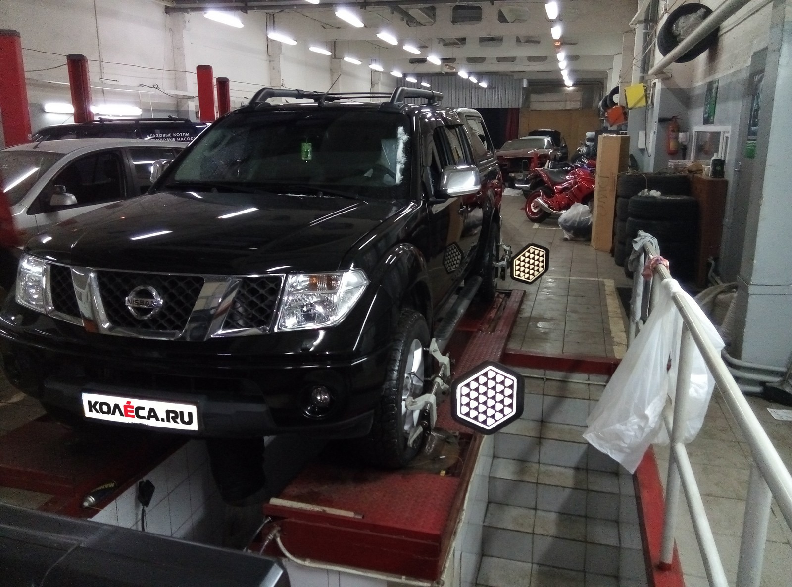 Wheel alignment equipment on a car